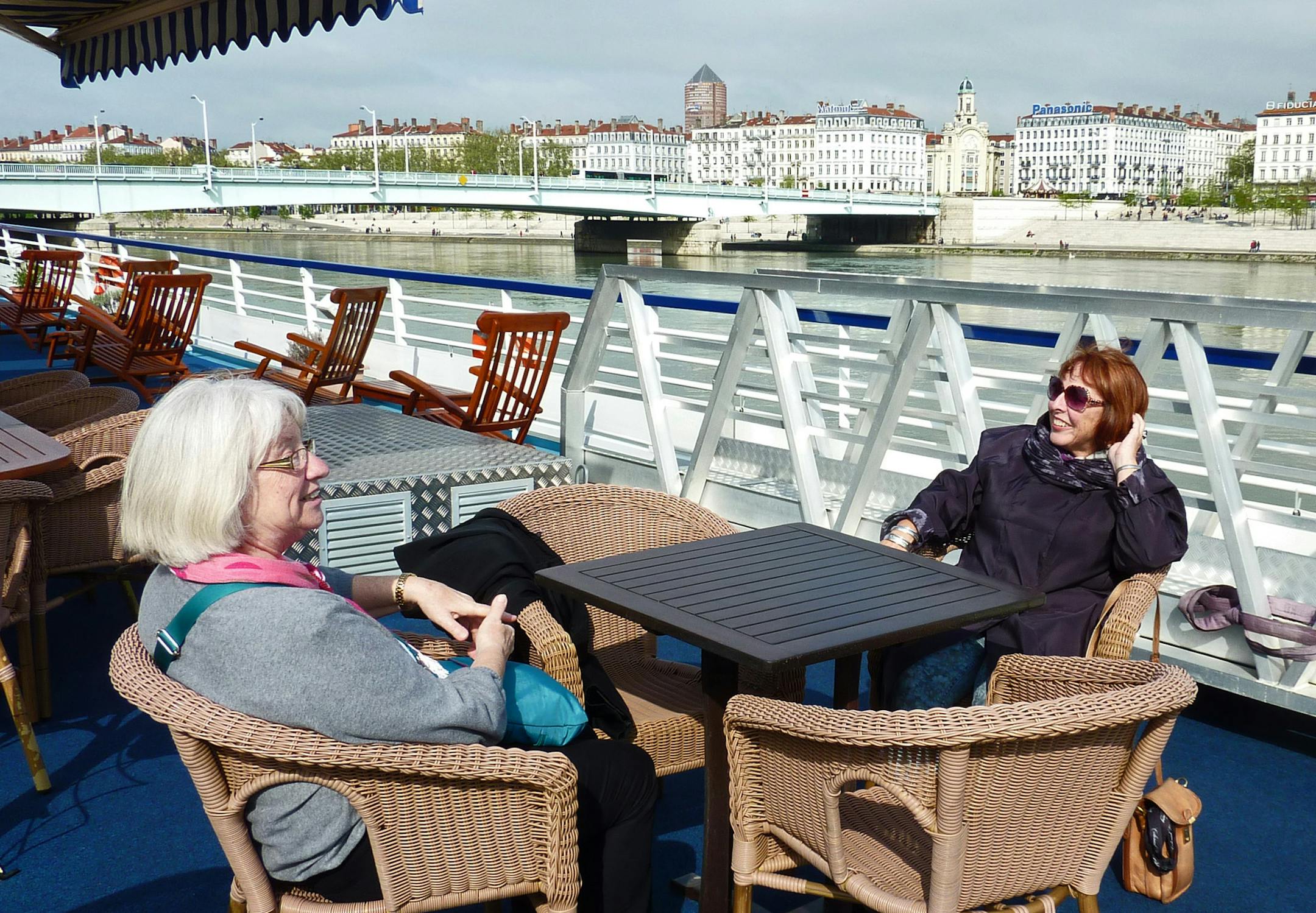 Enjoying a rare moment of sunshine on the boat’s deck. [ Peg Meier takes a river cruise through France and discovers that pampering and knowledgeable guides can make a trip lots better. francetr070713