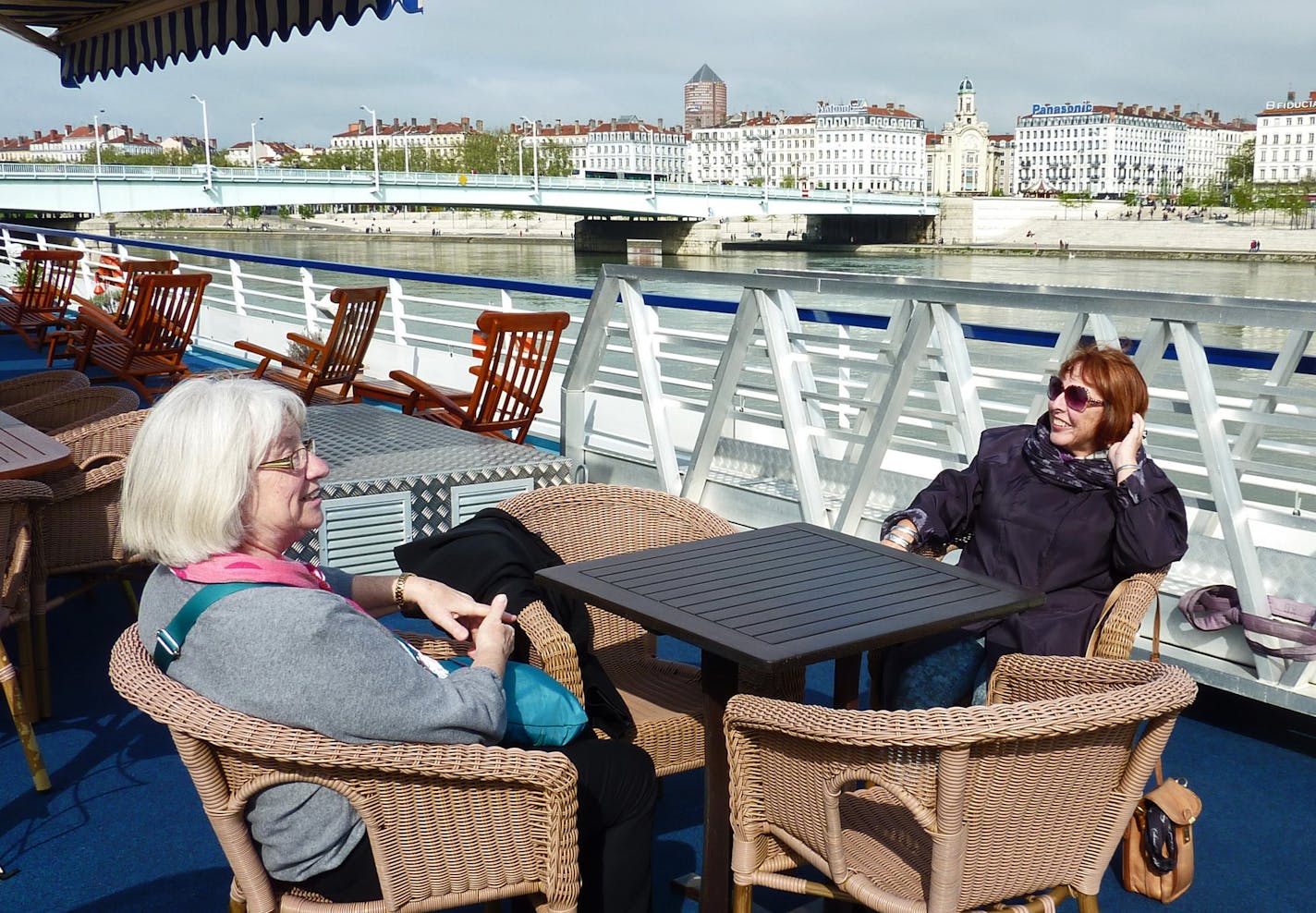 Enjoying a rare moment of sunshine on the boat&#x2019;s deck. [ Peg Meier takes a river cruise through France and discovers that pampering and knowledgeable guides can make a trip lots better. francetr070713