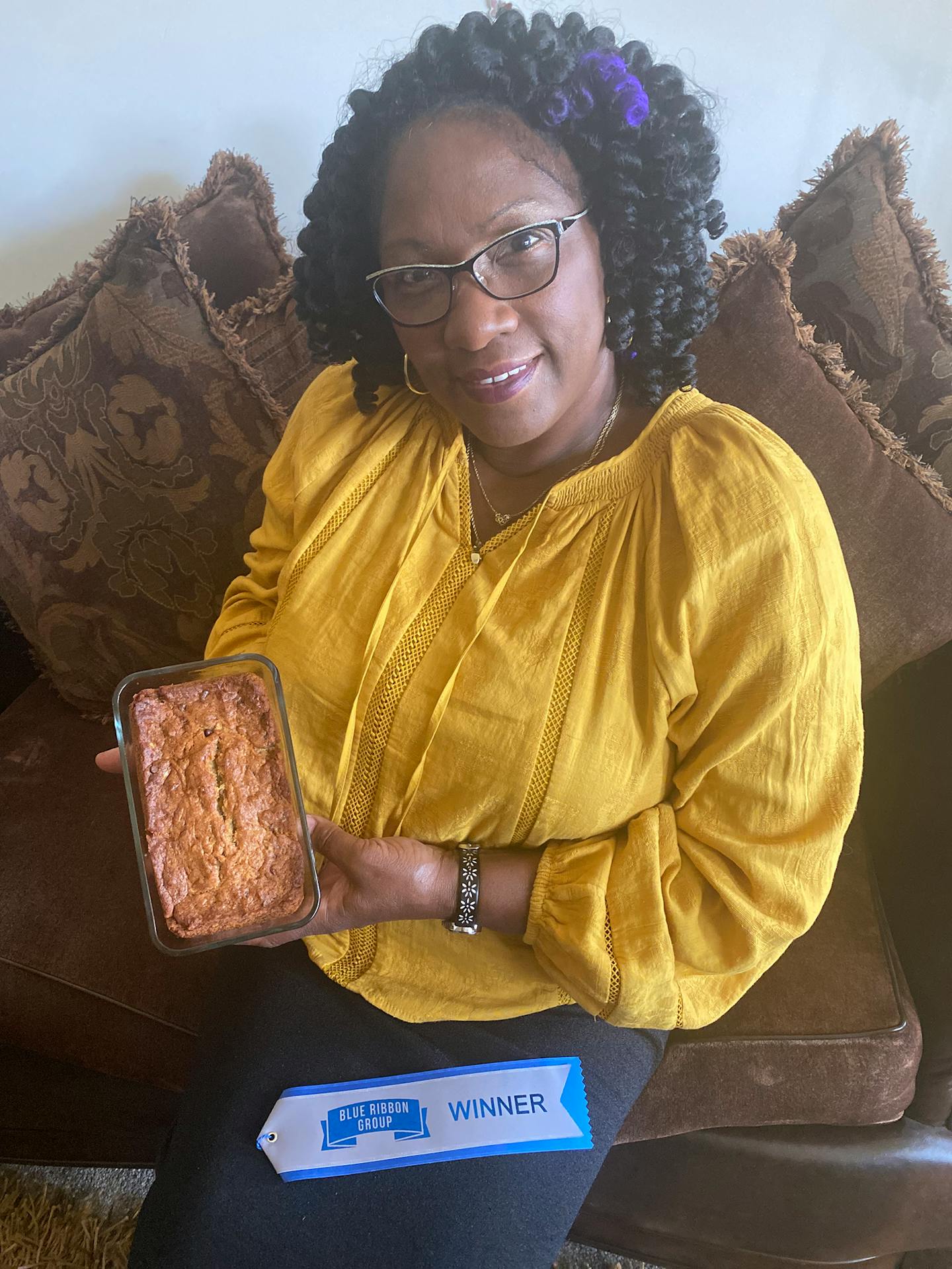 Gina Walker of Savage with her award-winning banana bread — and her blue ribbon. Provided