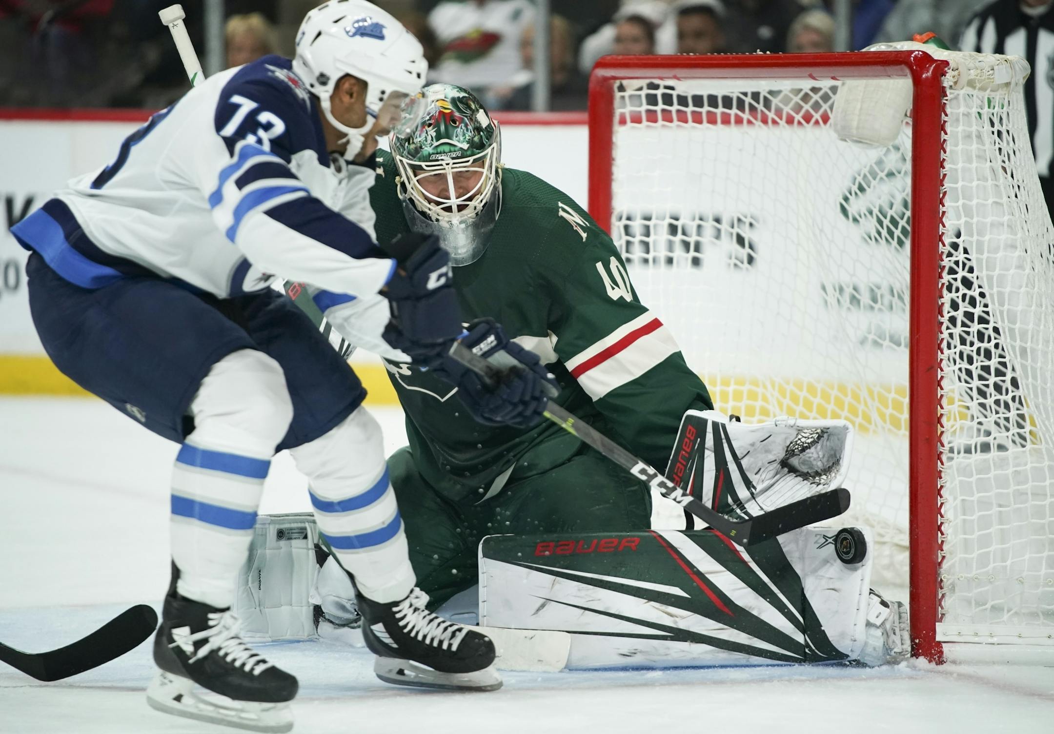 Minnesota Wild goaltender Devan Dubnyk stopped a second period shot by Winnipeg Jets left wing C.J. Suess (73).