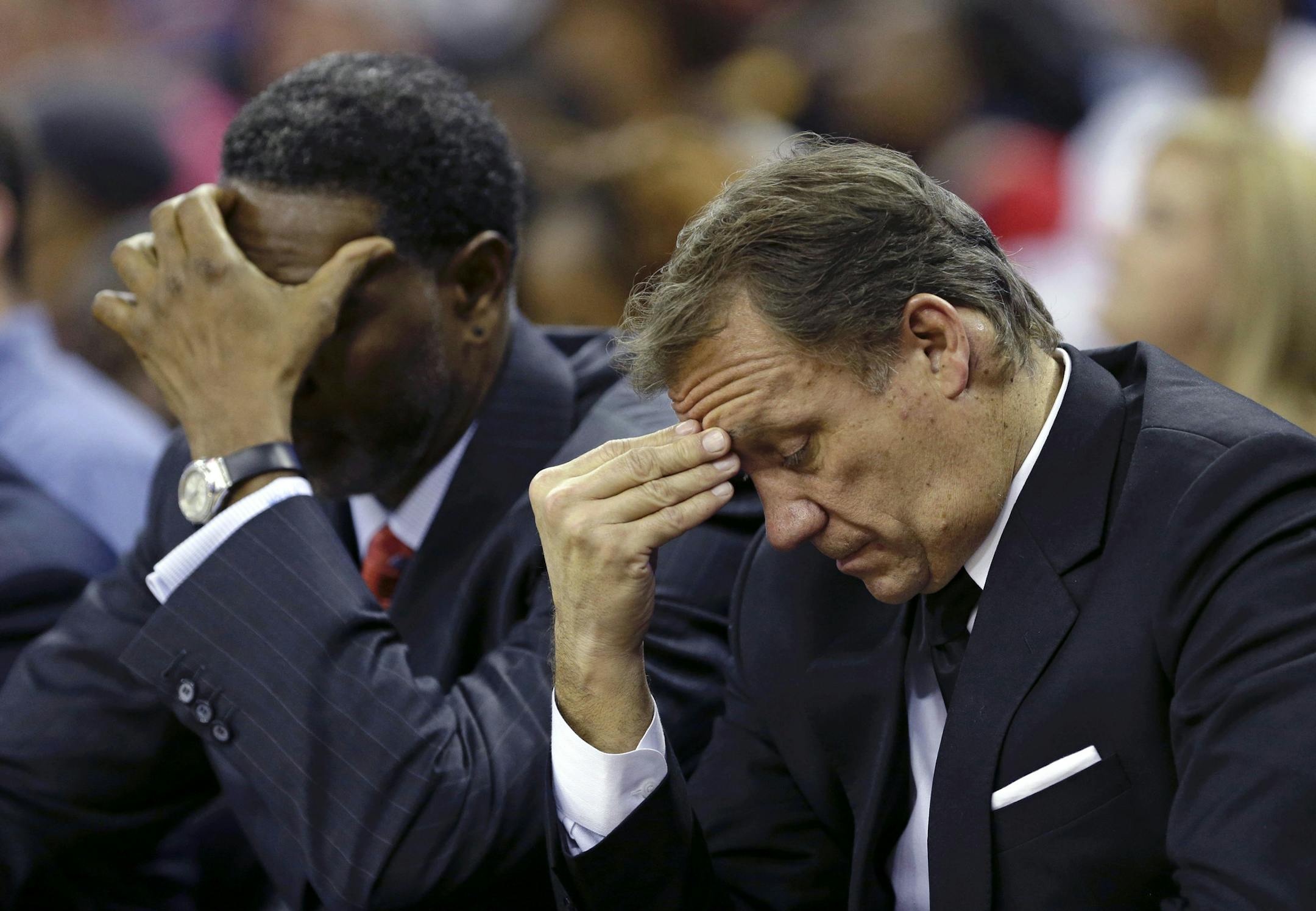 Minnesota Timberwolves head coach Flip Saunders, right, and assistant coach Sam Mitchell react in the fourth quarter of an NBA basketball game in New Orleans, Friday, Nov. 14, 2014. The Pelicans won 139-91. (AP Photo/Gerald Herbert)