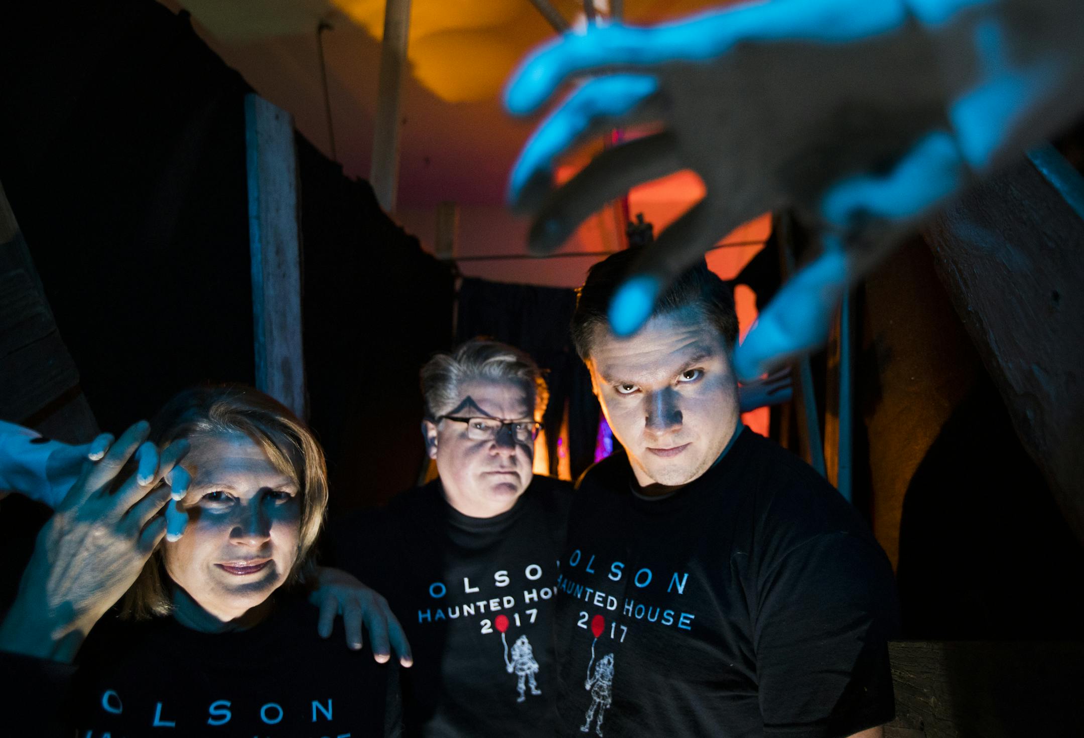 Holly Olson, from left, her husband Bruce and their son Mac pose inside the Olson Haunted House in Chanhassen. ] LEILA NAVIDI ï leila.navidi@startribune.com BACKGROUND INFORMATION: The Olson Haunted House in Chanhassen on Tuesday, October 24, 2017. The Olson family have turned their garage into a haunted attraction for the past 16 years to help with special causes. This year's haunted house and horror maze will be open on Saturday, October 28 and on October 31 from 6:30 pm until 11 pm. All