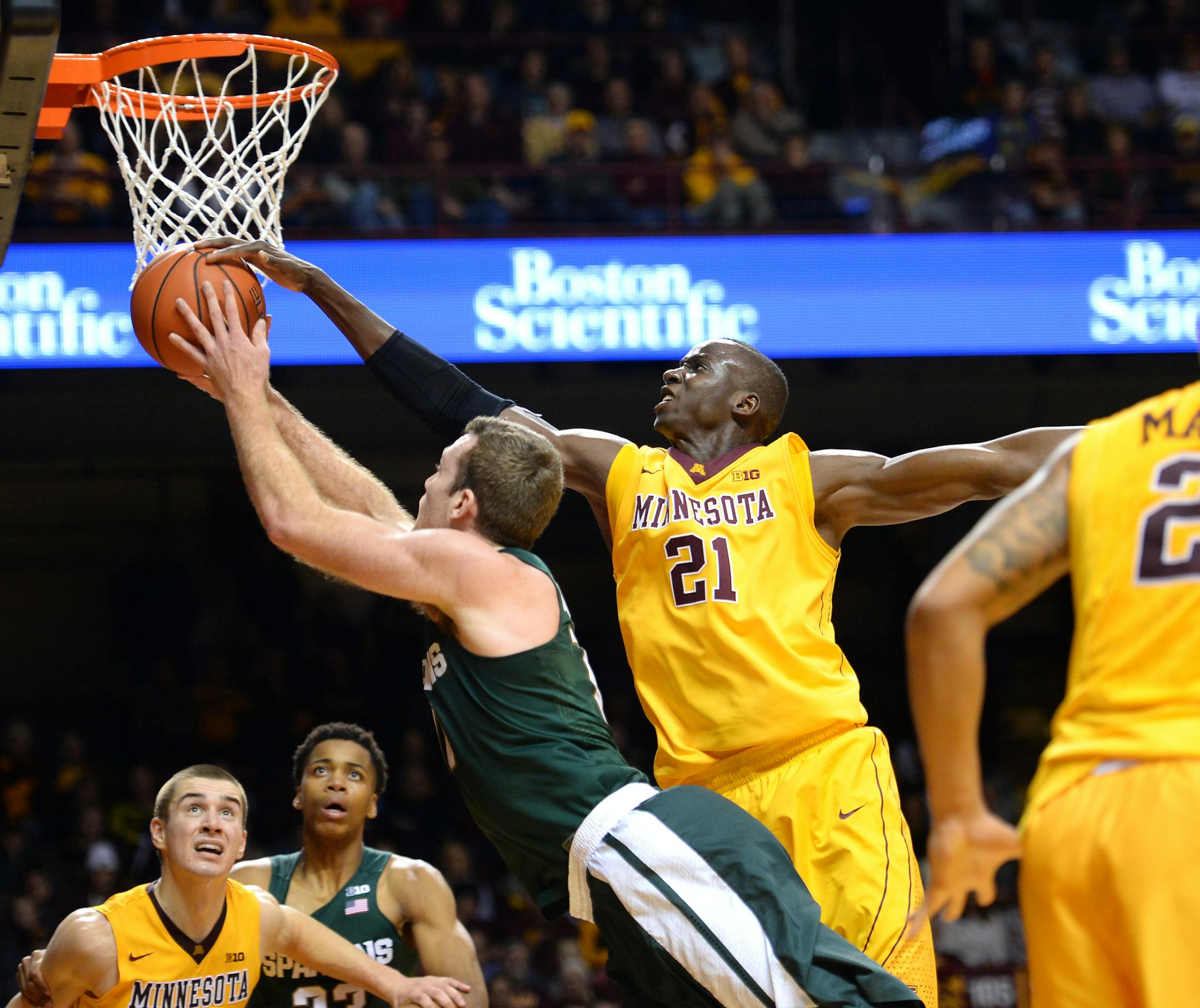 Michigan State Spartans forward Matt Costello (10) drew a shooting foul on Minnesota Golden Gophers center Bakary Konate (21) in the first half Saturday. ] (AARON LAVINSKY/STAR TRIBUNE) aaron.lavinsky@startribune.com The University of Minnesota Golden Gophers men's basketball team played the Michigan State Spartans on Saturday, Jan. 2, 2016 at Williams Arena in Minneapolis, Minn.