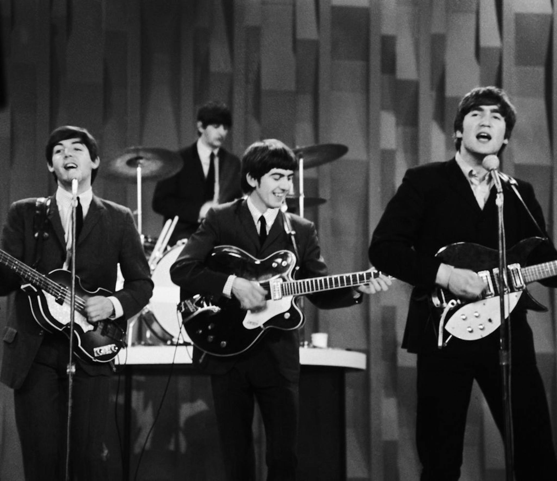 FILE - In this Feb. 9, 1964 file photo, The Beatles perform on the CBS "Ed Sullivan Show" in New York. Ringo Starr plays drums, rear, and playing guitars from left are Paul McCartney, George Harrison and John Lennon. An estimated 73 million Americans tuned in, the largest ever for a TV show at the time, or three times the amount of people who watched the latest "American Idol" finale, according to the Nielsen Co.