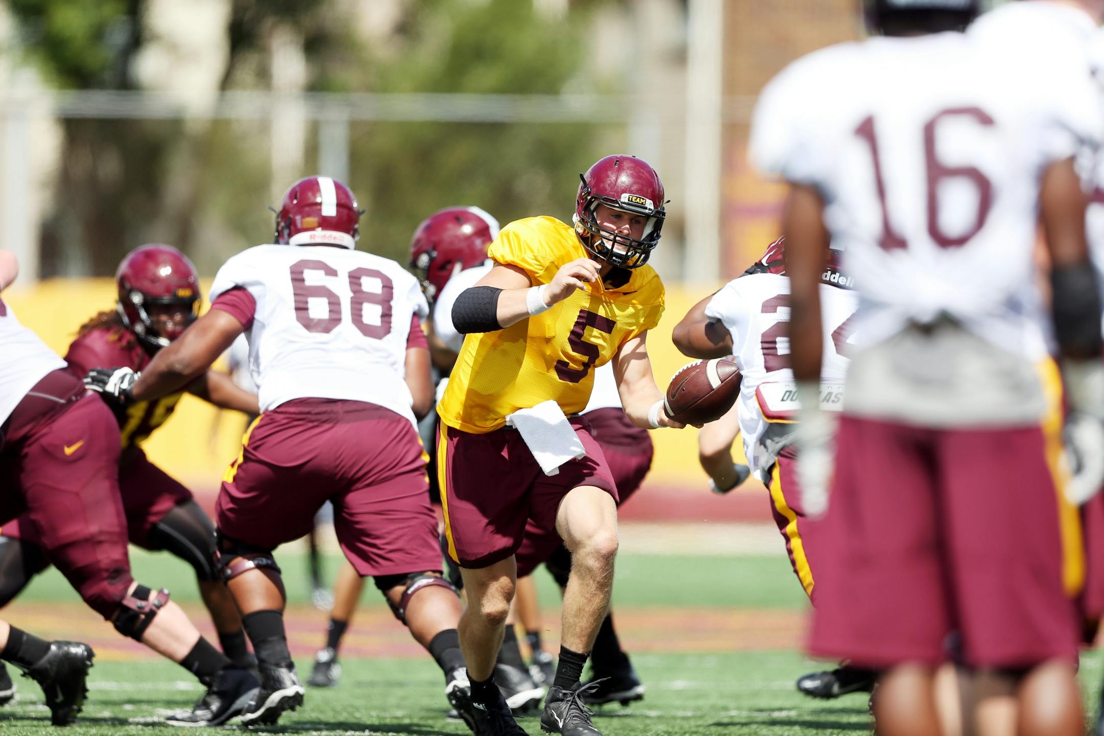 Quarterback Chris Streveler handed of to Rodney Smith during the team's first full practice of training camp.