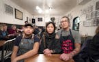 Left to right, Chef Chris Her of Union Kitchen, Eve Wu, and her husband Eddie Wu, owner of Cook St. Paul in Minnesota sit for a portrait on Dec. 15, 2