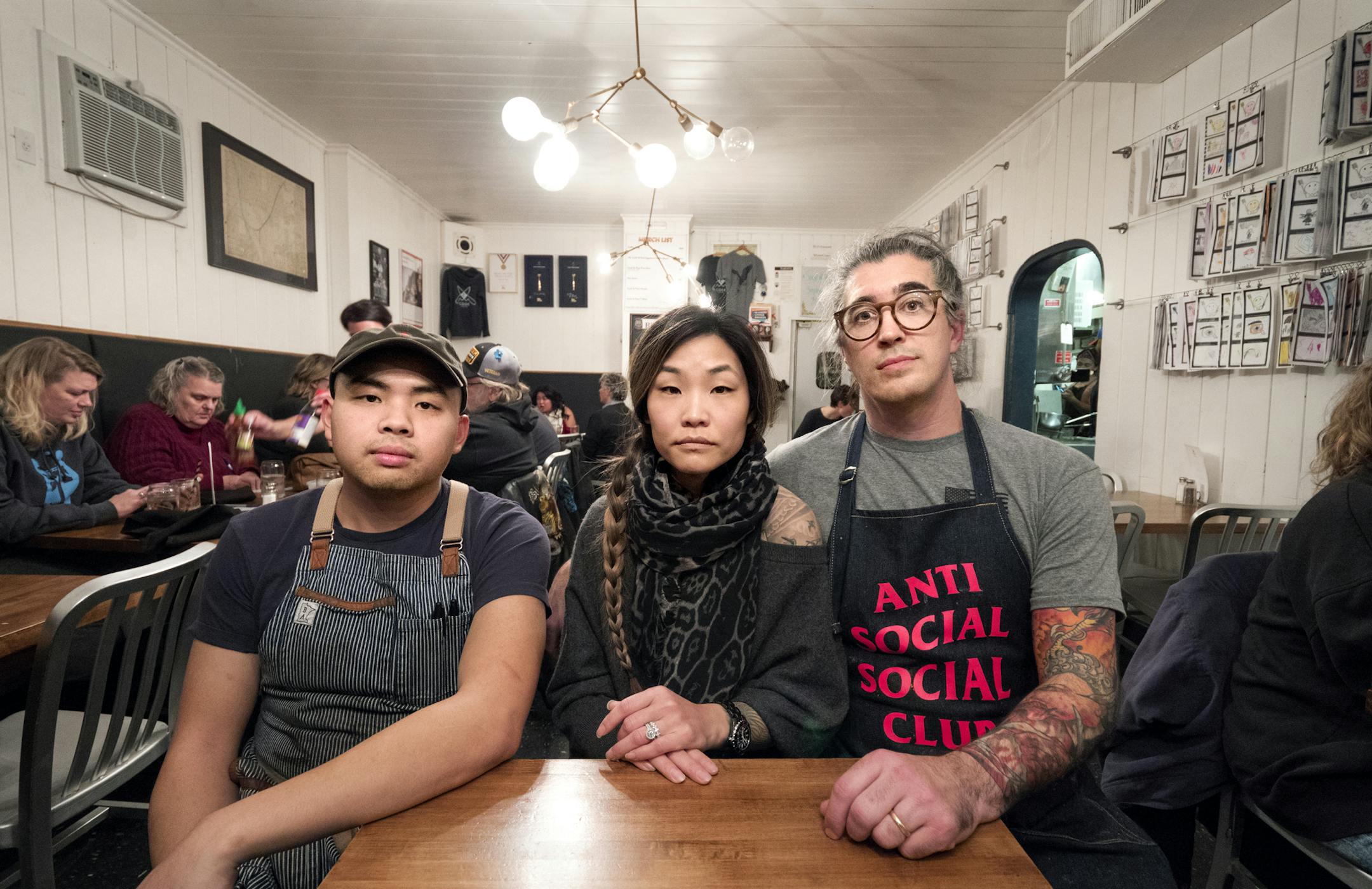 Left to right, Chef Chris Her of Union Kitchen, Eve Wu, and her husband Eddie Wu, owner of Cook St. Paul in Minnesota sit for a portrait on Dec. 15, 2018. MUST CREDIT: Photos for The Washington Post by Courtney Perry