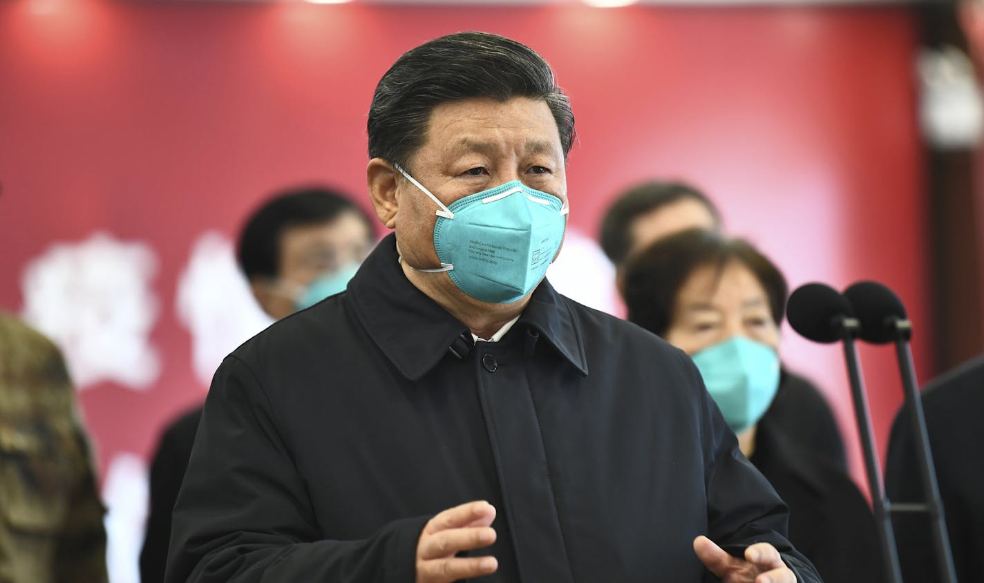 FILE - In this March 10, 2020 file photo released by China's Xinhua News Agency, Chinese President Xi Jinping talks by video with patients and medical workers at the Huoshenshan Hospital in Wuhan in central China's Hubei Province. Americans are increasingly hostile to China as the coronavirus pandemic wreaks havoc on the U.S. and global economies and after three years of Trump administration antagonism toward the country, according to a nationwide poll released on Tuesday. The poll conducted las