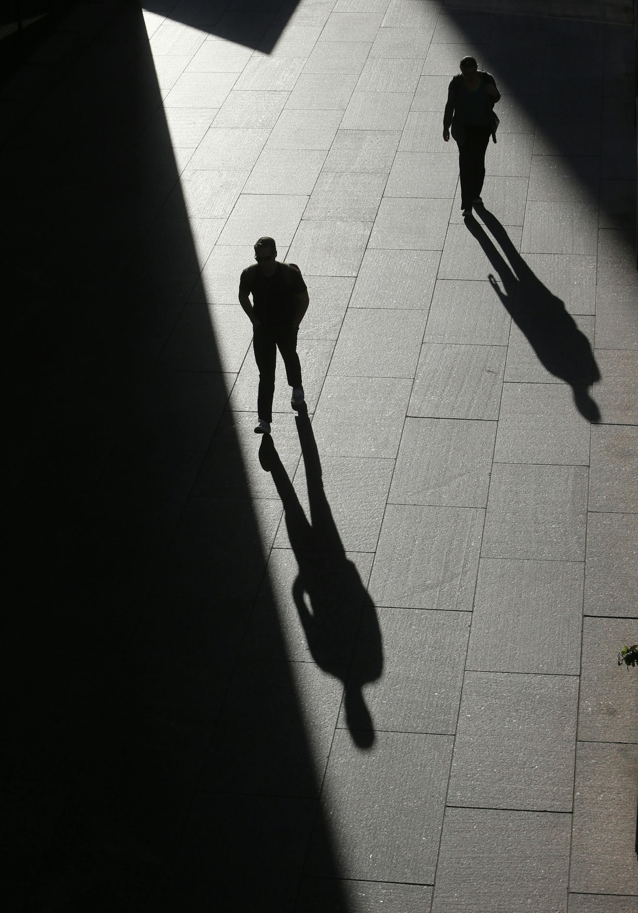 Pedestrians cast long shadows as seen from a skyway near 3rd Avenue S. and 6th St. S. Wednesday, Sept. 16, 2015 in Minneapolis MN.](DAVID JOLES/STARTRIBUNE)djoles@startribune.com Pedestrians cast long shadows as seen from a skyway near 3rd Avenue S. and 6th St. S. ORG XMIT: MIN1509160921041778