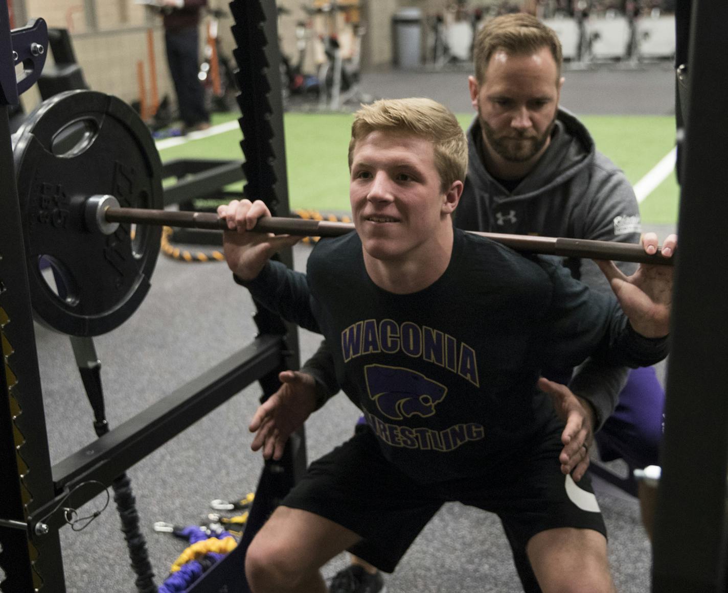 Strength and conditioning coach Josh Anderson spotted wrestler Tyler Wagener as he did a progressive load squat at Waconia High School on Monday, December 18, 2017, in Waconia, Minn. ] REN&#xc9;E JONES SCHNEIDER &#x2022; renee.jones@startribune.com