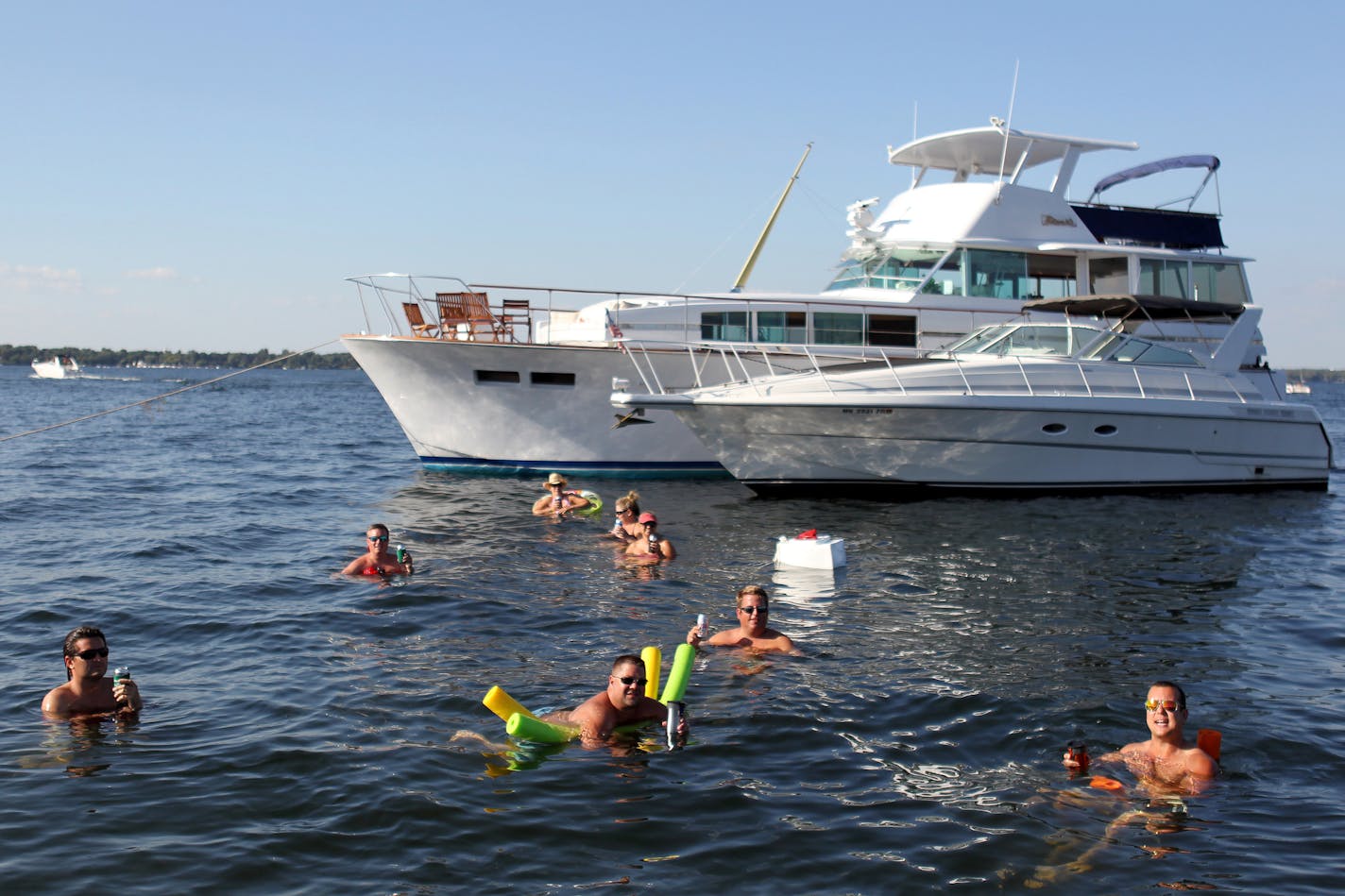 A group of friends float at Cruiser's Cove on Lake Minnetonka near Orono, Minn., on Friday, August 16, 2013. ] (ANNA REED/STAR TRIBUNE) anna.reed@startribune.com (cq)