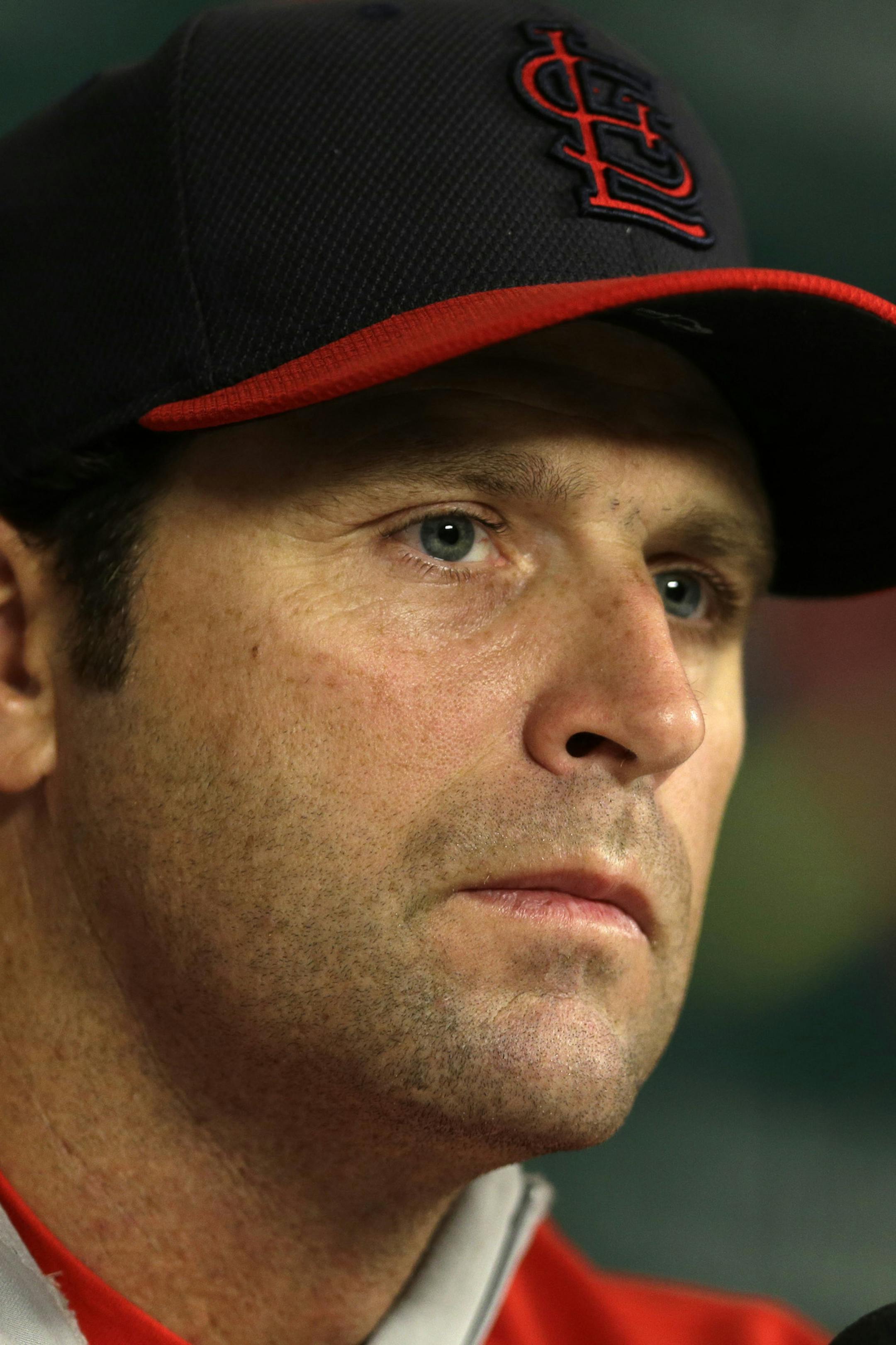 St. Louis Cardinals manager Mike Matheny listens to a question during a news conference Friday, Oct. 10, 2014, in St. Louis. The St. Louis Cardinals and San Francisco Giants are scheduled to play Game 1 of baseball's National League Championship Series on Saturday in St. Louis. (AP Photo/Jeff Roberson) ORG XMIT: MOJR107