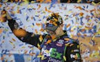 Denny Hamlin celebrates after winning the NASCAR Sprint Cup auto race at Richmond International Raceway in Richmond, Va., Saturday, Sept. 10, 2016. (A