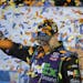 Denny Hamlin celebrates after winning the NASCAR Sprint Cup auto race at Richmond International Raceway in Richmond, Va., Saturday, Sept. 10, 2016. (A