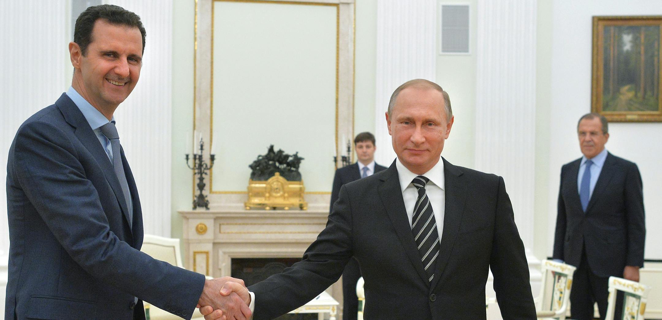 FILE - In this Tuesday, Oct. 20, 2015 file photo, Russian President Vladimir Putin, center, shakes hand with Syrian President Bashar Assad as Russian Foreign Minister Sergey Lavrov, right, looks on in the Kremlin in Moscow, Russia. U.S. Secretary of State Rex Tillersonís statement Tuesday, April 11, 2017, that the reign of President Bashar Assadís family ìis coming to an endî suggests Washington is taking a much more aggressive approach about the Syrian leader. Taking him out