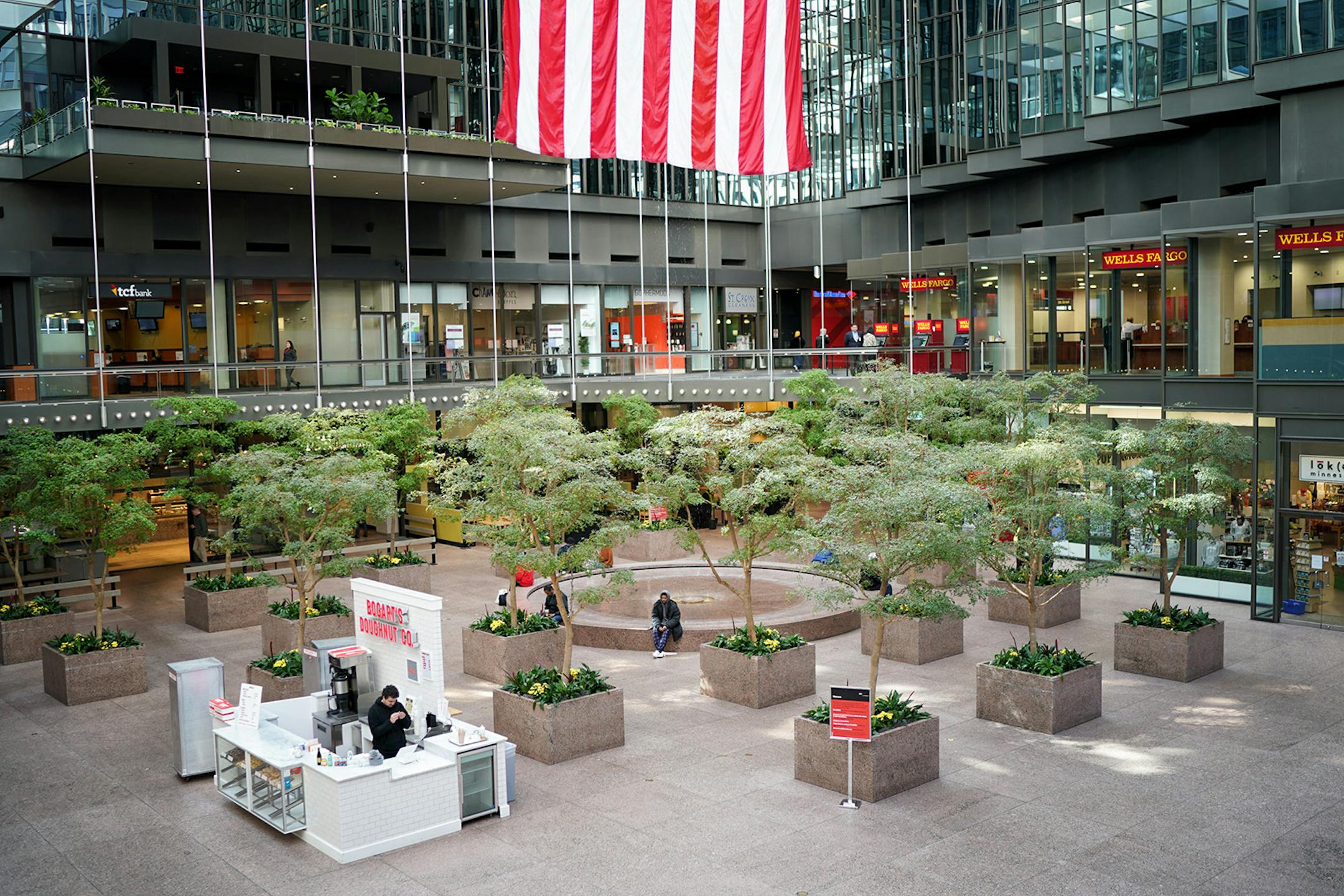 The IDS Center Crystal Court was unusually quiet for a weekday lunch hour. A few people were still moving around in downtown Minneapolis but nothing near the lunch hour weekday crowds.