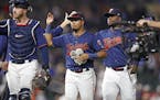 Minnesota Twins second baseman Luis Arraez (2) holds a plush squirrel as the Minnesota Twins celebrated their 5-0 win.