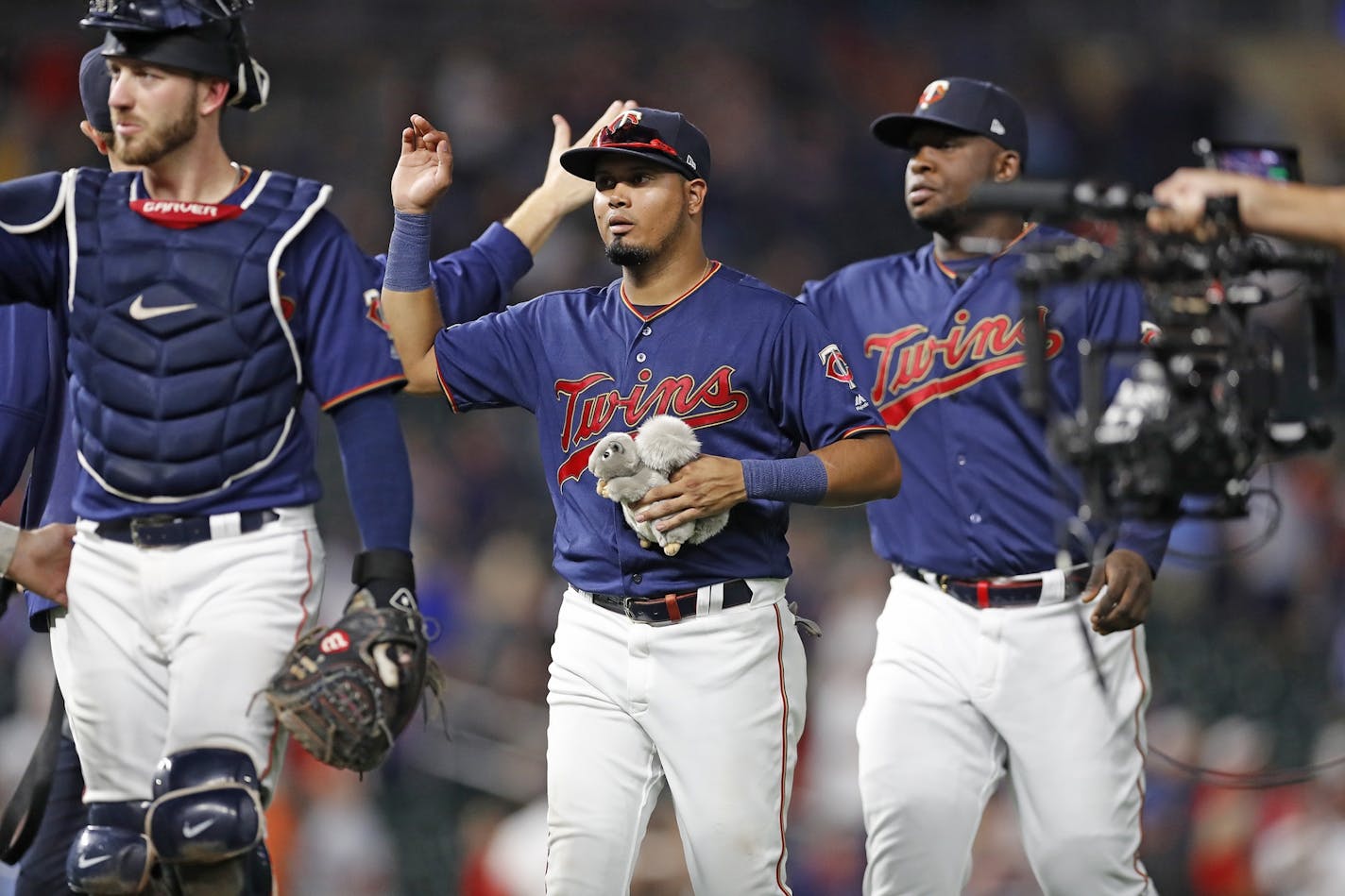 Minnesota Twins second baseman Luis Arraez (2) holds a plush squirrel as the Minnesota Twins celebrated their 5-0 win.