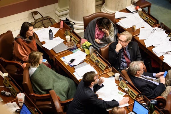 Some lawmakers huddled under blankets at 6:33 a.m. as the special session 7:00 a.m. adjournment time came closer.