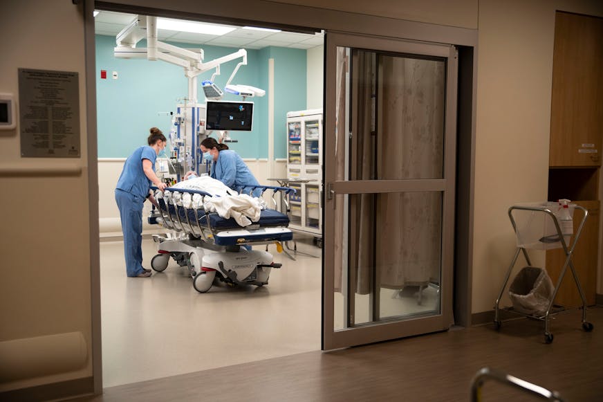 Two nurses set up a patient in his room in St. Luke's Emergency Department in Duluth
