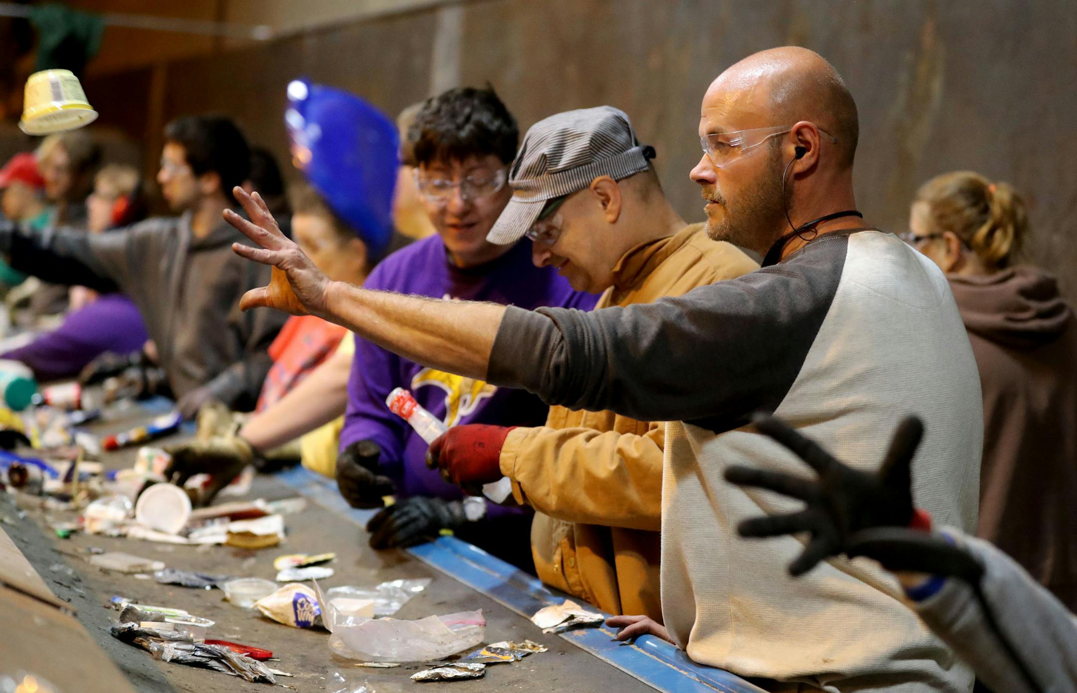 Disabled workers like John Week, 37, have opportunities that they never thought possible. Workers who once toiled for years in dead-end jobs are now making up to $14 an hour at an MRI facility and have opportunities for advancement. Here, Week, right, steps in on the recycling sorting line while floating at various jobs at MDI's newly opened plastics fabrication and recycling plant Tuesday, Sept. 27, 2016, in Cohasset, MN. ](DAVID JOLES/STARTRIBUNE)djoles@startribune.com For years, Minnesota Div