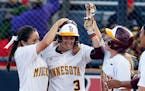 Minnesota's Erica Meyer (3) celebrates with teammates Erika Smyth (6) and Ellie Cowger (33) after defeating New Mexico State in a Division I NCAA coll
