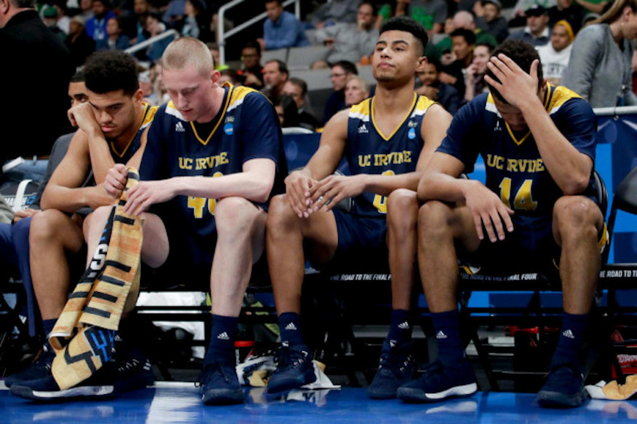 UC Irvine players sit on the bench during their loss to Oregon in a second-round game in the NCAA men's college basketball tournament Sunday, March 24, 2019, in San Jose, Calif. (AP Photo/Jeff Chiu)