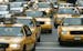 New York City taxis move uptown on Manhattan's 8th Ave., Tuesday Oct. 4, 2005. Taxi regulators have been exploring the possibility of requiring all ci