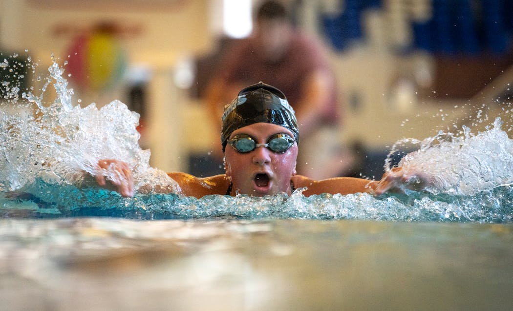 Adaptive swimmer Sophia Nohre practices laps at the Courage Kenny Rehabilitation Institute pool.