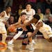Caleb Williams, surrounded by Gophers, still puts up 41 points in Macalester's exhibition loss at Williams Arena last Nov. 2.