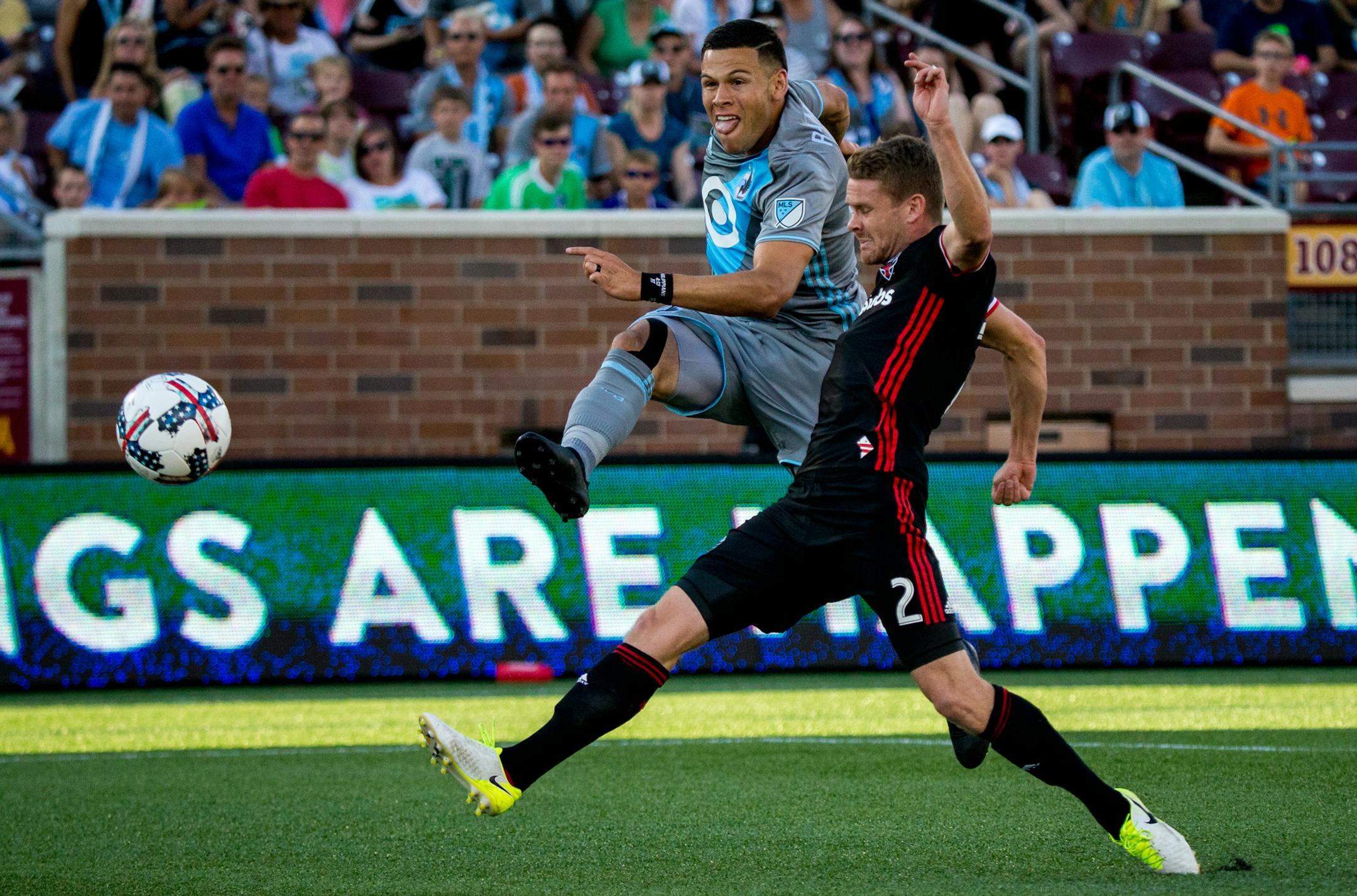 Minnesota United’s Christian Ramirez (left) scores a goal while D.C. United’s Taylor Kemp attempts to block during the first half on Saturday, July 29, 2017, at TCF Bank Stadium. ] COURTNEY PEDROZA • courtney.pedroza@startribune.com; July 29, 2017; Minnesota United vs. D.C. United; TCF Bank Stadium; Minneapolis, MN.