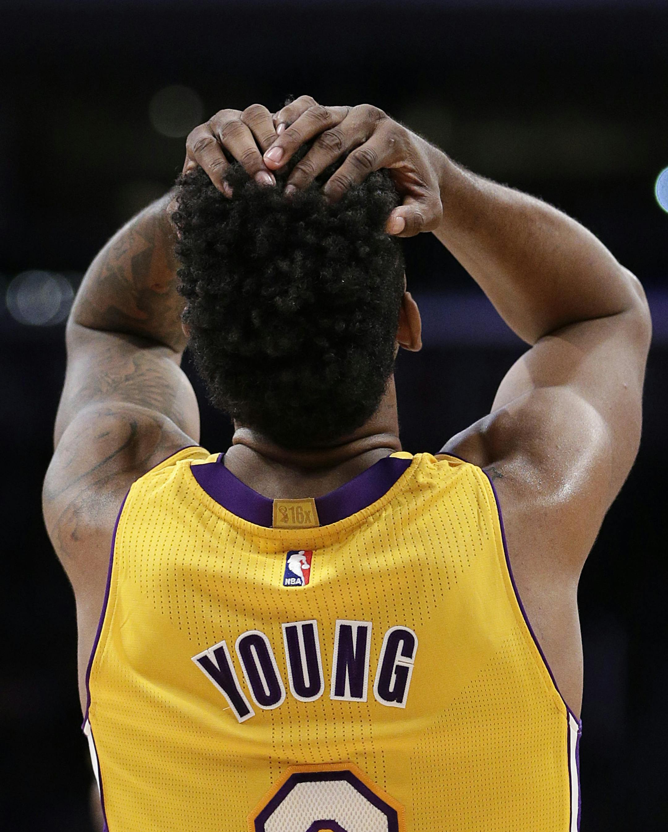 Los Angeles Lakers' Nick Young reacts to a foul call on teammate Carlos Boozer during the second half of an NBA basketball game against the Denver Nuggets on Tuesday, Feb. 10, 2015, in Los Angeles. The Nuggets won 106-96. (AP Photo/Jae C. Hong) ORG XMIT: LAS112