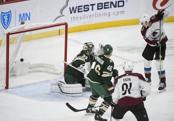 Colorado Avalanche defenseman Cale Makar (8) was credited with a second period goal against Minnesota Wild goaltender Alex Stalock (32) in the second 