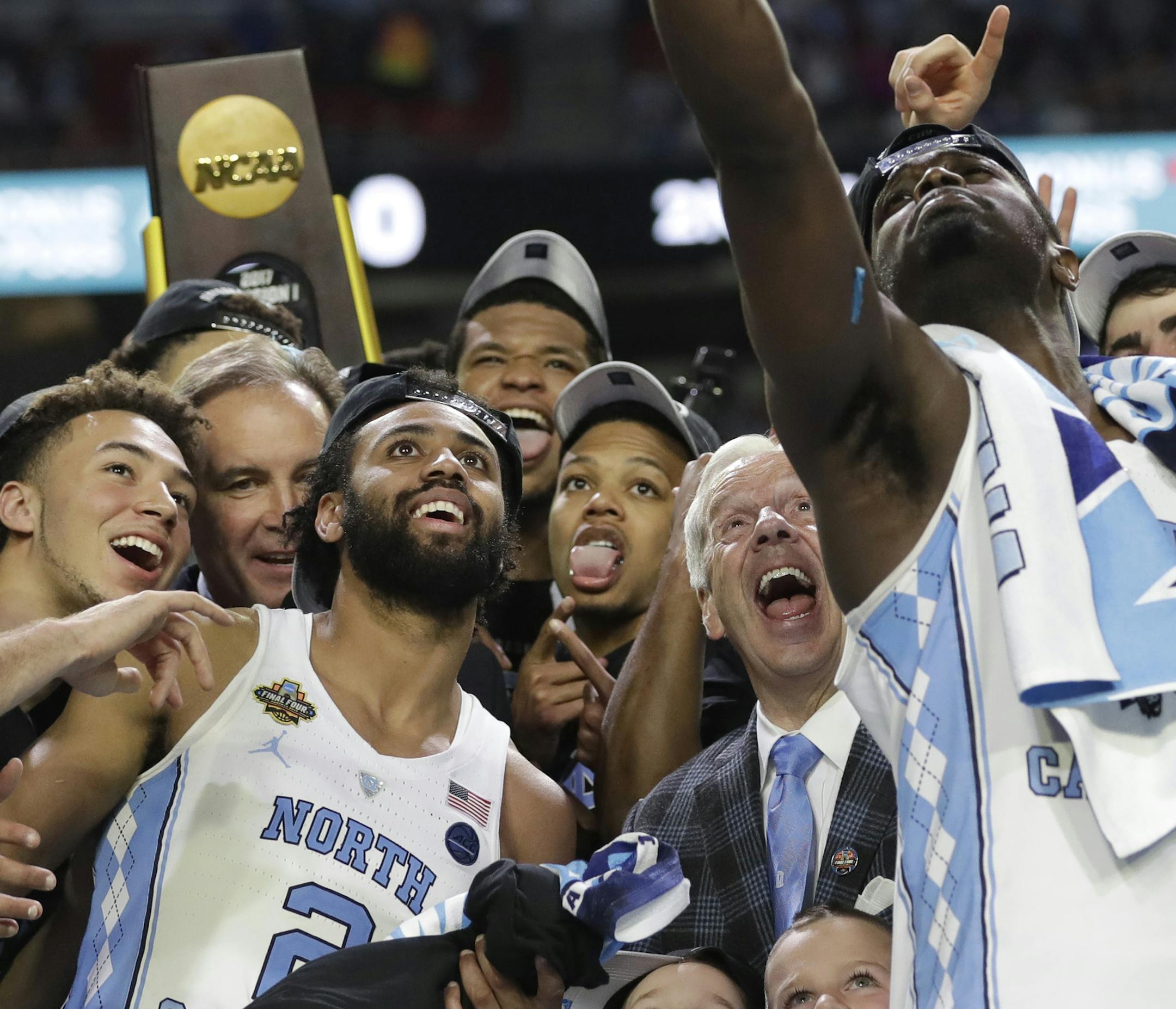 North Carolina players celebrate after the championship game against Gonzaga at the Final Four NCAA college basketball tournament, Monday, April 3, 2017, in Glendale, Ariz. North Carolina 71-65. (AP Photo/David J. Phillip)