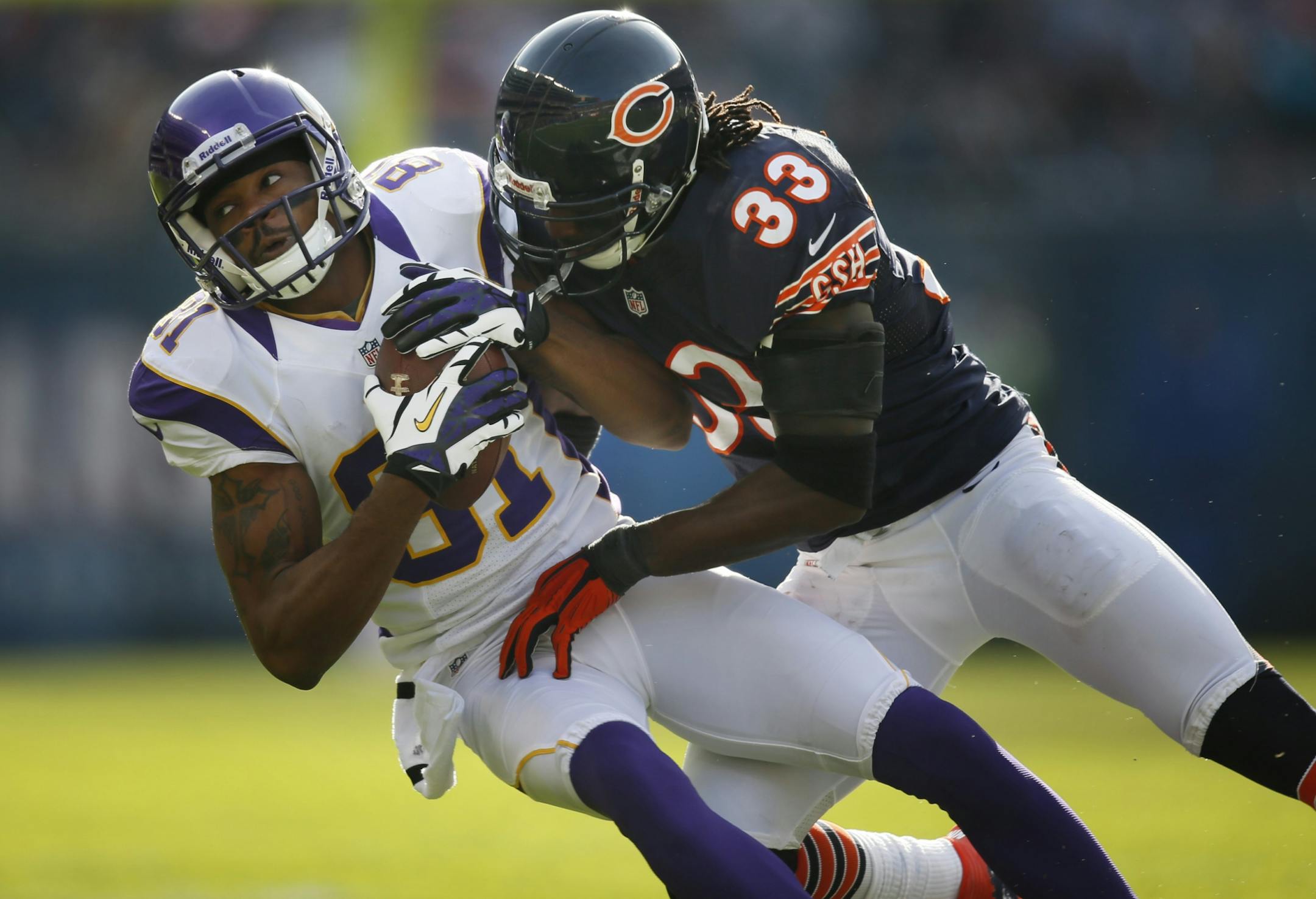 receiver Jerome Simpson (81) was tackled by Chicago Bears cornerback Charles Tillman (33) in the first quarter during NFL action between the Bears and Vikings Sunday Nov.25,2012 at Solider Field in Chicago, IL.