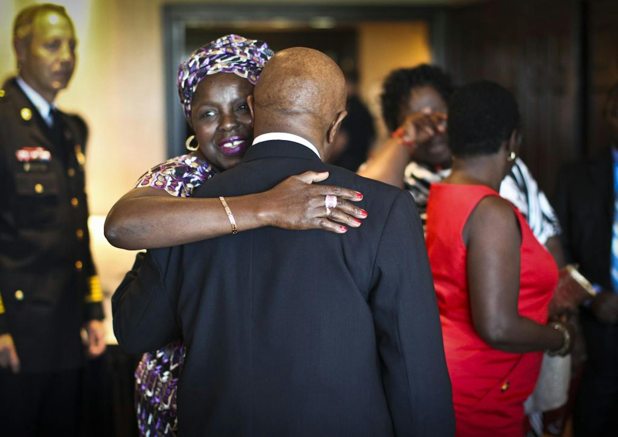 Vice President Joseph Boakai greeted Marie Hayes of New Hope, who knew him in Liberia, during a dinner on Wednesday at the Edinburgh Golf Course.