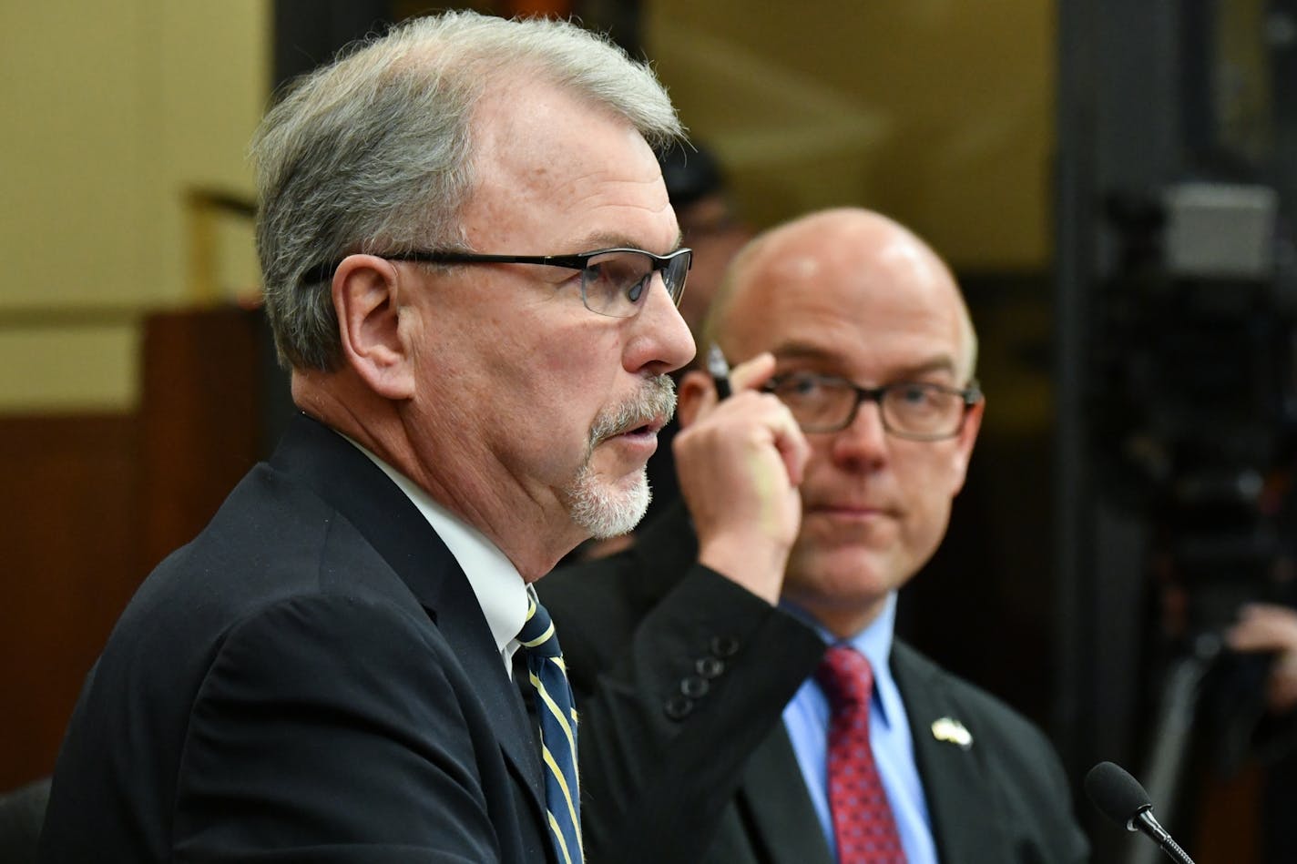 Minnesota Department of Corrections Commissioner Tom Roy, left, spoke against Rep. Tim Miller's bill to reopen the Appleton prison. Miller, right.