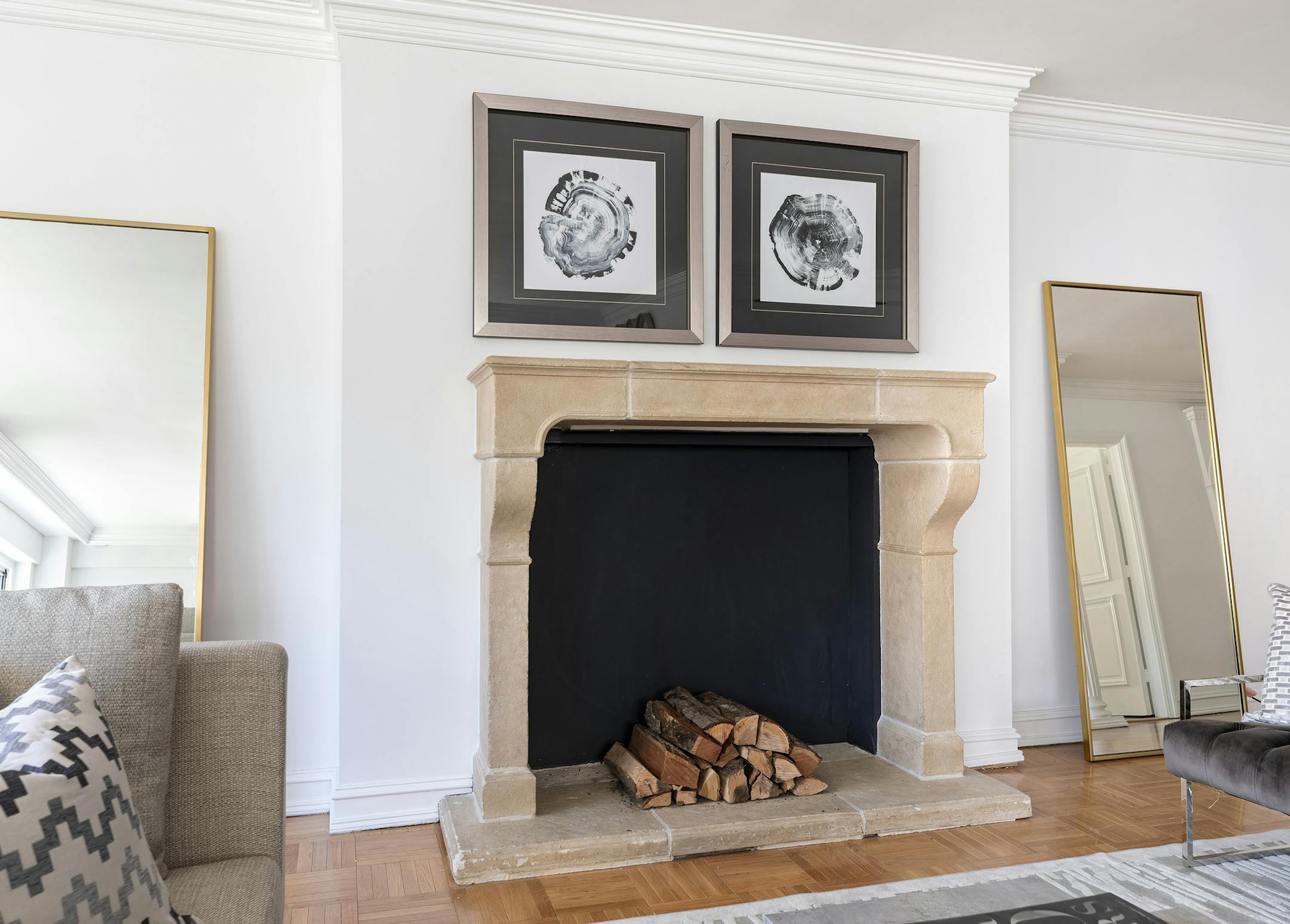 Large floor mirrors on either side of the fireplace help highlight the fireplace and reflect light. (Design Recipes)