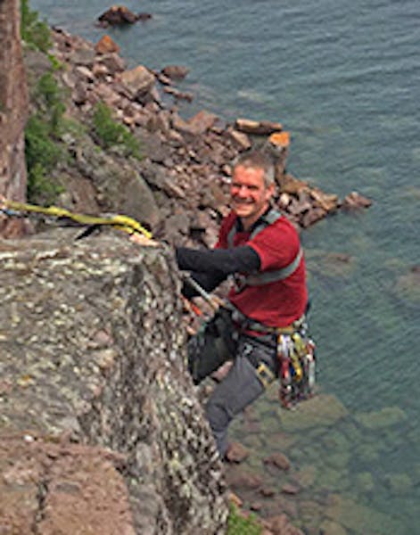 Kris Gorny of Rochester on Monday lowered himself over a Lake Superior cliff at Palisade along Minnesota's North Shore.