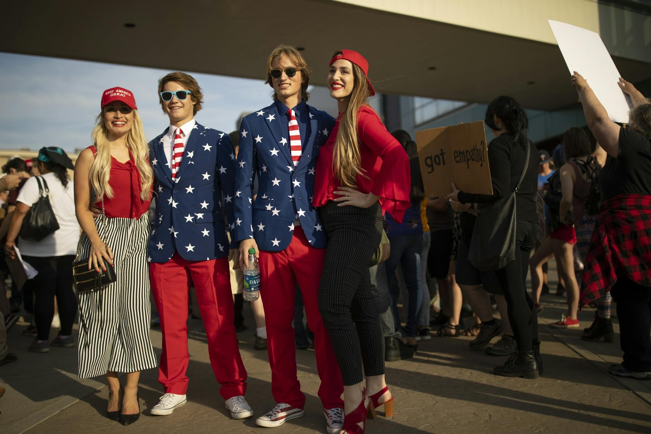 Niko Sexton, left, and Jack Olson of Plymouth were popular with the pro-Trump crowd outside Amsoil Arena Wednesday evening.