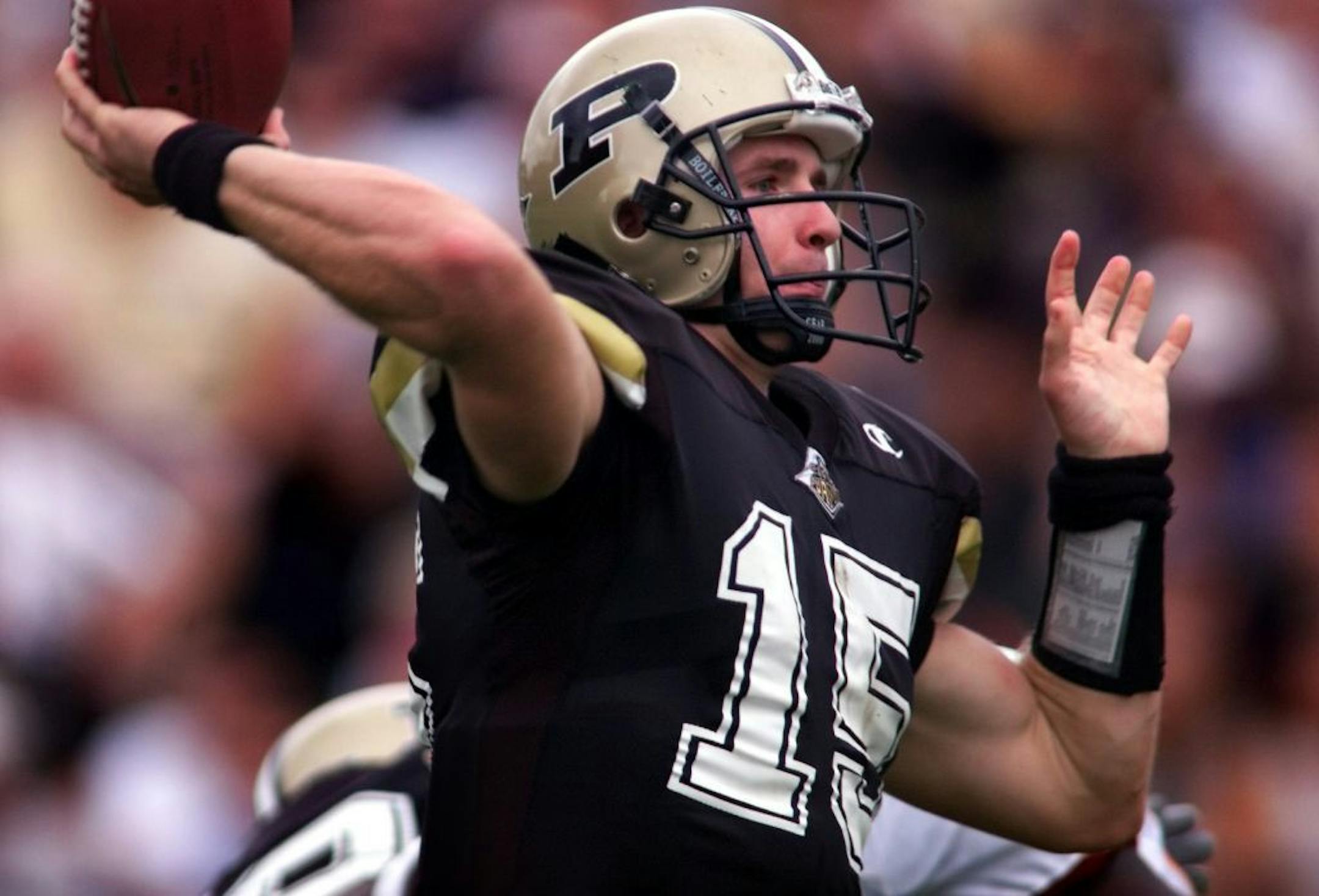 Purdue QB Drew Brees, #15, attempts a pass in the 1st half of Saturday's game.