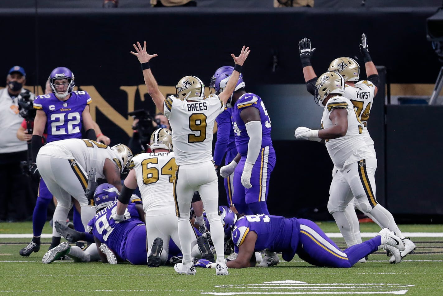 New Orleans Saints quarterback Drew Brees (9) reacts after running back Alvin Kamara scored his sixth rushing touchdown of the game, tying an NFL record, in the second half of an NFL football game against the Minnesota Vikings in New Orleans, Friday, Dec. 25, 2020. During the game, Brees also became the first NFL player to reach 80,000 yards passing. The Saints won 52-33. (AP Photo/Brett Duke)