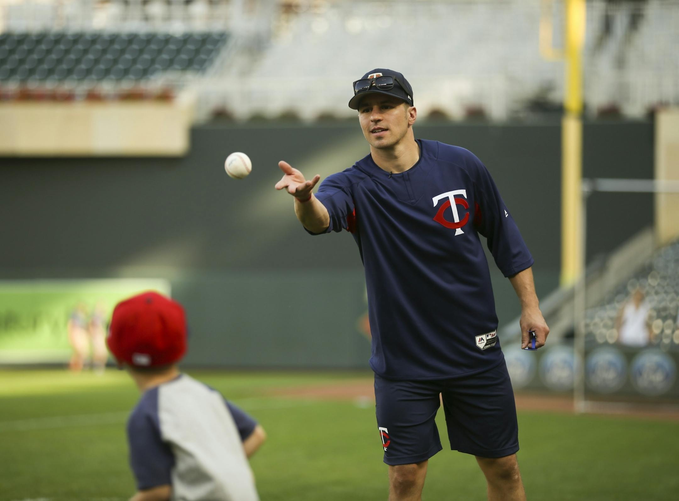 The Wild's Zach Parise pitched to his son, Jackson, while the Twins took batting practice before Wednesday night's game against the Yankees. Wild players are participating in the ceremonial first pitch before the game.