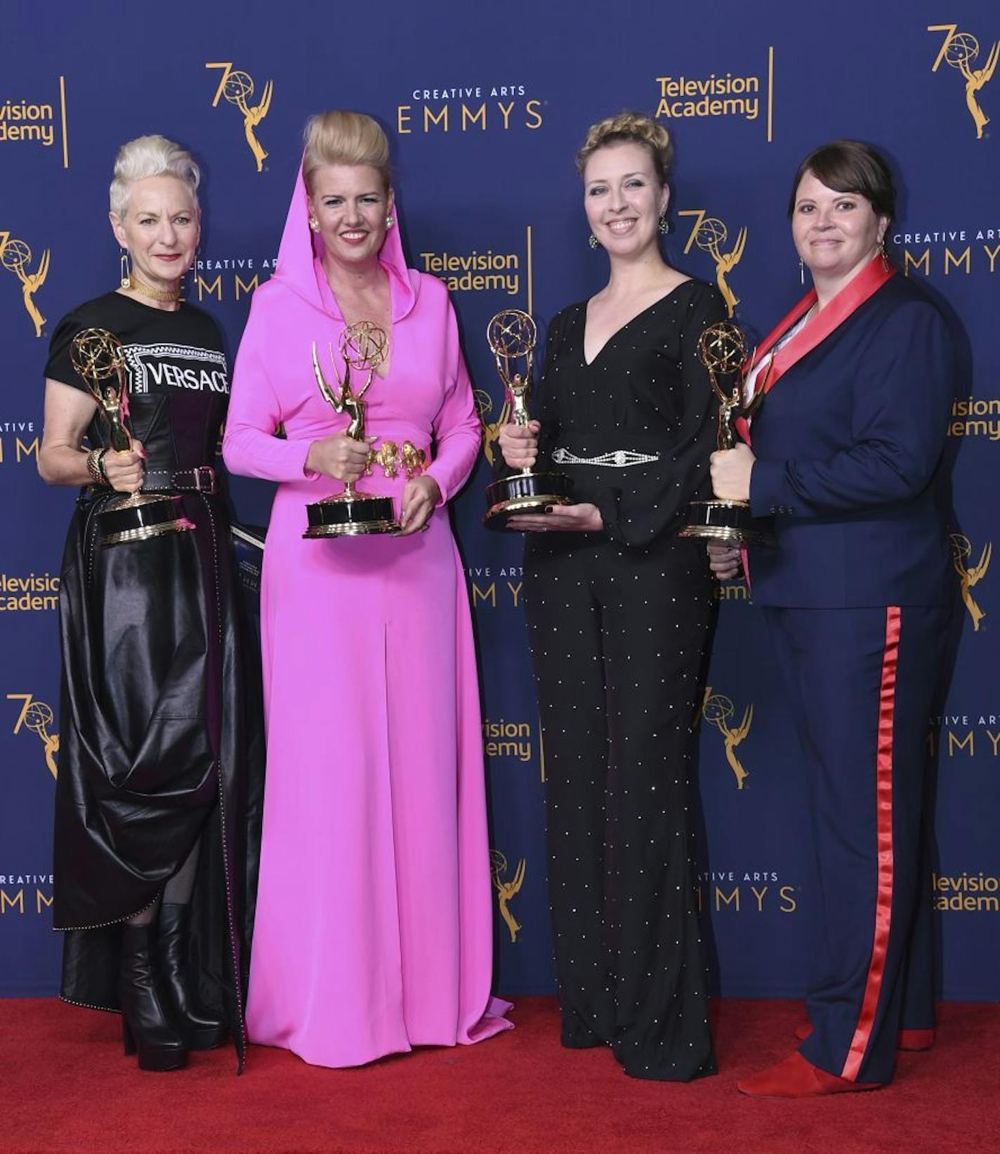 Lou Eyrich, from left, Allison Leach, Rebecca Guzzi, and Nora Pedersen pose in the press room with the award for outstanding contemporary costumes for the "The Man Who Would Be Vogue" episode of "The Assassination of Gianni Versace: American Crime Story" during night one of the Creative Arts Emmy Awards at The Microsoft Theater on Saturday, Sept. 8, 2018, in Los Angeles.