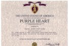 Mikhail Wicker falsified a document that contended he was awarded a Purple Heart, according to prosecutors.