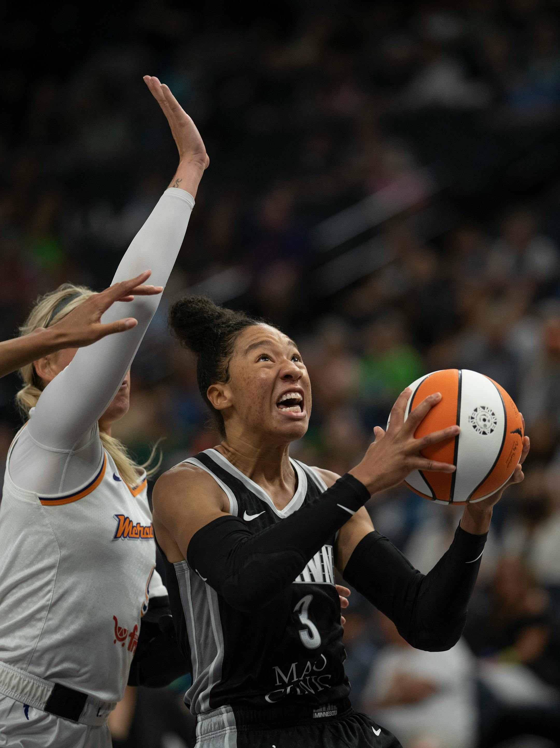 Minnesota Lynx forward Aerial Powers (3) drives past Phoenix Mercury guard Sophie Cunningham (9) in the first half.