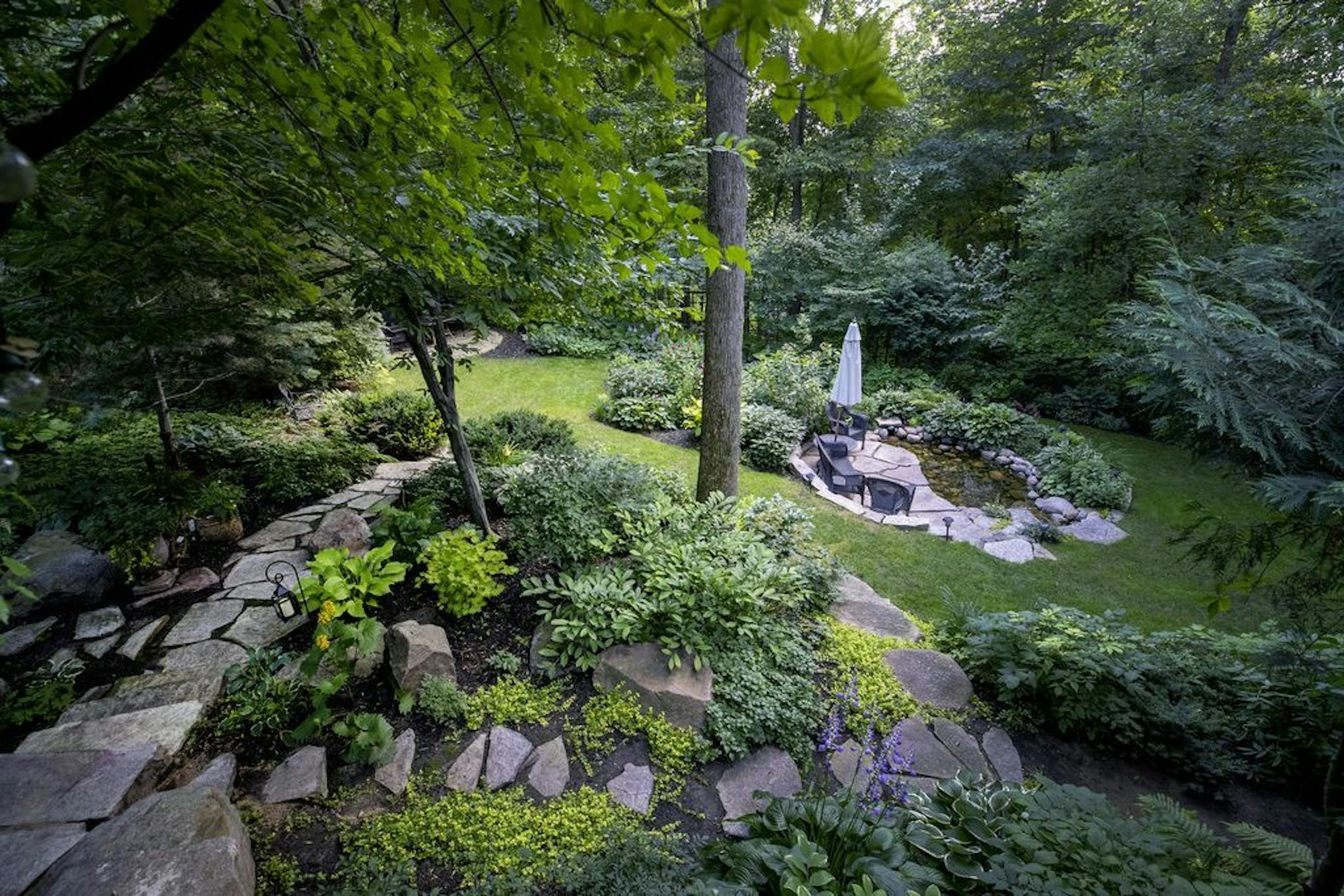 The Colsons re-created a woodland habitat on their property with 27 garden rooms.