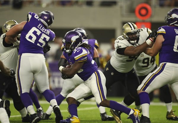 Vikings center Pat Elflein (65) helped clear the way for running back Dalvin Cook for a second-quarter run.