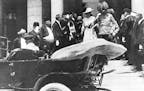 Archduke Franz Ferdinand of Austria-Hungary and his wife, Czech Countess Sophie Chotek, leave the reception at City Hall and walk toward an open car i