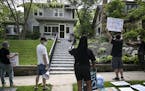 A few dozen protesters demanded justice for George Floyd outside the home of Hennepin County Attorney Mike Freeman Wednesday. ] aaron.lavinsky@startri